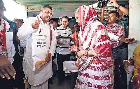 Pradhan distributing 5 kg rice to beneficiaries in Dhenkanal on Wednesday | Express
