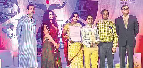 Ratnakar Sahoo and Chinmayee Das receive Shambhavi Puraskar 2022 and Jury Commendation Certificate respectively in Bhubaneswar on Thursday | Express