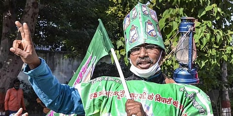 RJD supporter flashes victory sign. (File Photo | PTI)