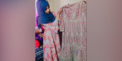 The 20-year-old Shaharabanu displaying a bridal dress.