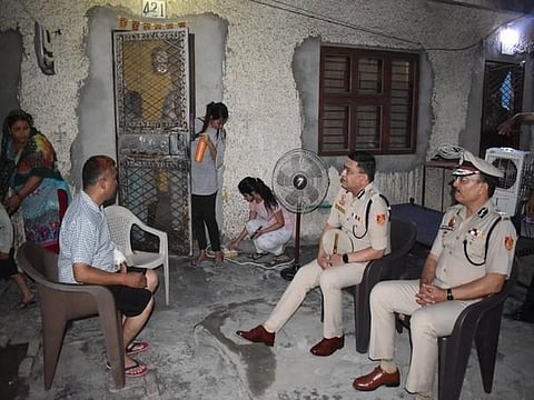 Delhi Police Commissioner meets sub-inspector of police injured in a stone pelting in Jahangirpuri. (Photo | ANI Twitter)