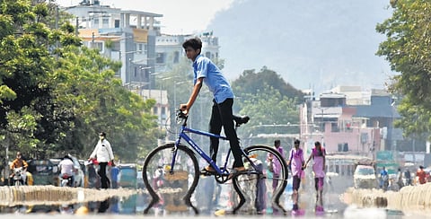Simmering heat creates a mirage on BRTS road in Vijayawada. (File photo | P Ravindra Babu)