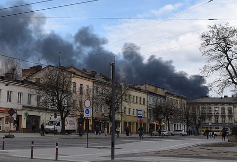 Dark smoke rises following an air strike in the western Ukrainian city of Lviv, on April 18, 2022. (AFP)
