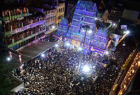 Devotees participate in Karaga procession at Dharmarayaswamy Temple. (Photo | Shriram BN, EPS)