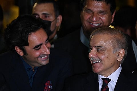 Shahbaz Sharif (R) and Bilawal Bhutto Zardari smile during a press conference. (File Photo | AFP)