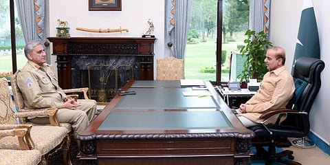 Pakistan's Army chief General Qamar Javed Bajwa (L) meets PM Shehbaz Sharif (Photo| Twitter)