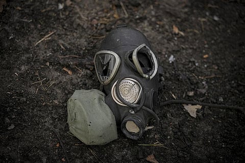 A damaged gas mask lies on the pavement at a Russian position which was overran by Ukrainian forces, outside Kyiv, Ukraine. (Photo | AP)