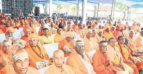Seers at a programme organised to mark the 115th birth anniversary of Sri Shivakumara Swamiji in Tumakuru on Friday | express