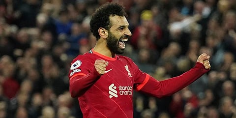 Liverpool striker Mohamed Salah celebrates after scoring his side's fourth goal during the EPL match against Manchester United at Anfield Stadium in Liverpool. (Photo | AP)