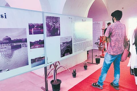 A viewer going through the exhibition