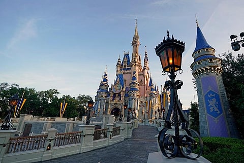 The newly painted Cinderella Castle at the Magic Kingdom at Walt Disney World is seen with the the crest to celebrate the 50th anniversary of the theme park . (Photo | AP)