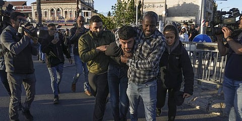 Undercover Israeli police detain a Palestinian man following minor clashes in Jerusalem's Old City, Wednesday, April 20, 2022. (Photo | AP)