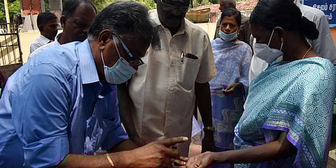 TNHB residents' association members affixing thier thumb impression in blood. (Photo| EPS)