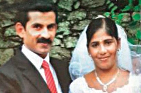 Wedding picture of Tomy Thomas and Nimisha Priya.