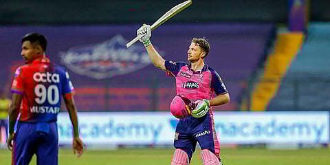 Rajasthan Royals' Jos Buttler celebrates after scoring a ton during an IPL 2022 against Delhi Capitals at Wankhede Stadium in Mumbai. (Photo| PTI)