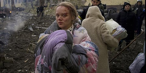 A woman outside a maternity hospital that was damaged by shelling in Mariupol. She later gave birth to a girl in another hospital in the city.(Photo | AP)