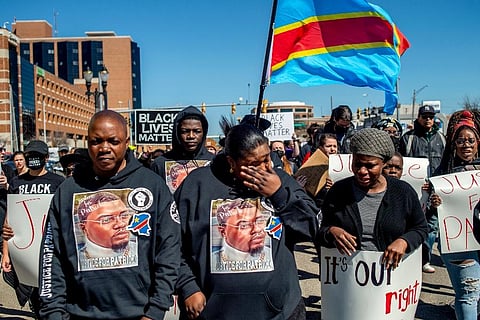 Peter and Dorcas Lyoya, parents of Patrick Lyoya, march with their family and supporters wearing all black or a rally at the Capitol in Lansing. (Photo | AP)