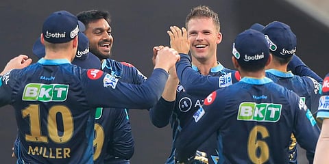 Lockie Ferguson of Gujarat Titans celebrates the wicket of Nitish Rana of the Kolkata Knight Riders. (Photo | PTI)