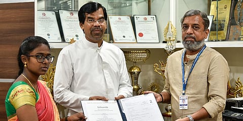 Asha Monica and Dr Senthil Kumar presenting the patent certificate to St Joseph's College Principal Dr M Arockiasamy Xavier SJ at the campus in Tiruchy. (Photo| MK Ashik Kumar, EPS)