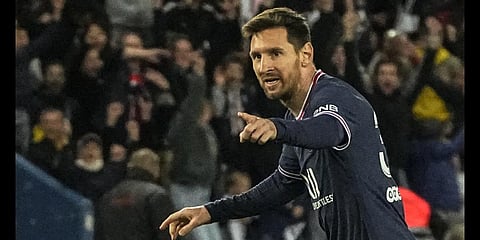 Lionel Messi celebrates after scoring the opening goal during the French League One soccer match between PSG and Lens Saturday, April 23, 2022.(AP Photo)