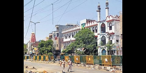 Policemen patrol in violence-hit Jahangirpuri area on Saturday.(Photo | PTI)