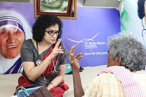 Neurologist Dr Bindu Menon interacts with a patient during a ‘Neurology-on-Wheels’ programme in Nellore district | Express