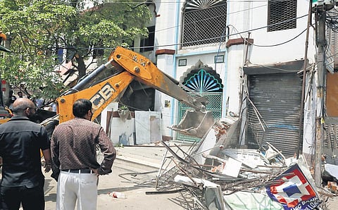 File - A bulldozer in action in Delhi’s Jahangirpuri area.