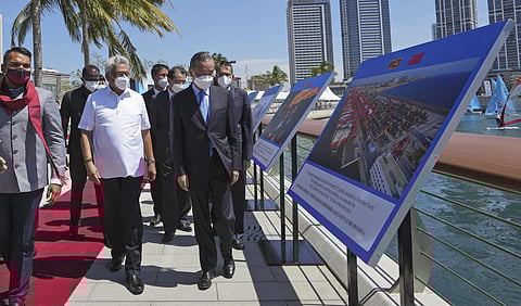 Sri Lankan President Gotabaya Rajapaksa, left, and Chinese Foreign Minister Wang Yi arrive at the Chinese funded sea reclamation Port City project in Colombo, Sri Lanka, Jan. 9, 2022. (File photo |AP)