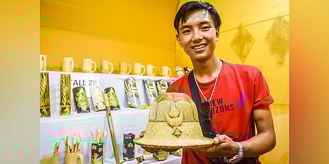 Artist displaying Lepcha traditional hat from Sikkim at the fair. (Photo| Express)