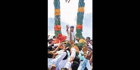 Congress supporters accord a flowery welcome to A Revanth Reddy at Nayakangudem village on Tuesday