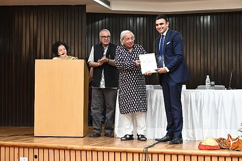 Anita Singh (co- convenor, Intach-Delhi chapter), KT Ravindaran (convenor, Intach-Delhi Chapter), Noted poet Ashok Vajpeyi handing over award to Samegh Batra of Friends of Heritage. (Photo | EPS)