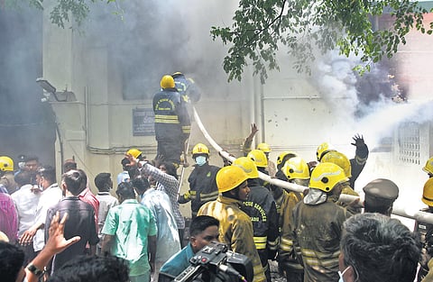 Firemen trying to put out the blaze at Bradfield surgical block