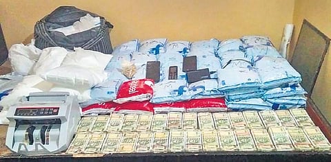 Heroin, cash and a money counting machine seized by NCB | Pti