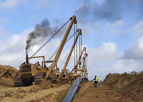 Heavy machines install a pipeline near Komotini town, northern Greece. (Photo | AP)