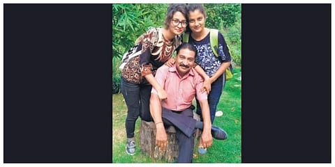 Rajiv Panthri with his two daughters at home in Dehradun. (Photo | Express)