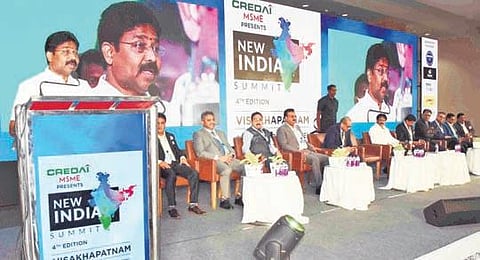 Minister for Municipal Administration A Suresh speaks at the inaugural of the fourth edition of New India Summit-2022 organised by CREDAI in Vizag on Friday . ( Photo | ESP)