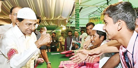 Chief Minister K Chandrasekhar Rao interacts with schoolchildren during the iftar party that was hosted at LB Stadium in Hyderabad on Friday. ( Photo | EPS)