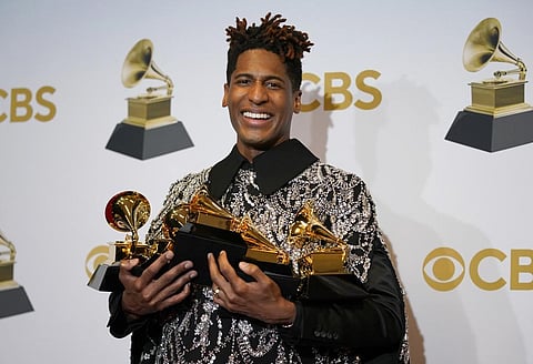 Jon Batiste, winner of the awards for several categories, poses in the press room. (Photo | AP)