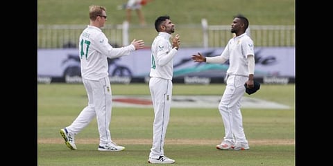 South Africa's Keshav Maharaj (C) prays after the victory during the fifth day of the first Test cricket against Bangladesh at the Kingsmead stadium in Durban on April 4, 2022.(Photo | AFP)