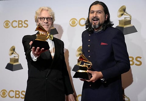 Stewart Copeland, left, and Ricky Kej pose in the press room with the award for best new age album for 'Divine Tides' at the 64th Annual Grammy Awards. (Photo | AP)