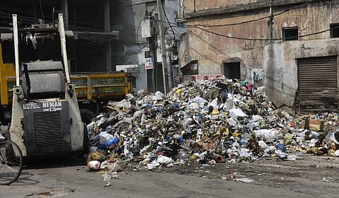 GHMC workers clear a garbage dump in the Old City of Hyderabad. (Photo | Vinay Madapu, EPS)