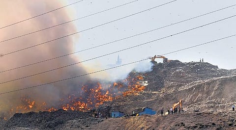 Flames and smoke rise from a fire at Ghazipur landfill. (Photo | EPS)