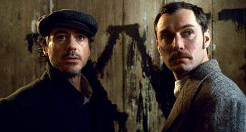Robert Downey Jr., left, and Jude Law are shown in a scene from 'Sherlock Holmes.' (Photo | AP)