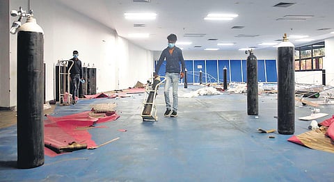 Workers dismantle Covid care equipment at the CWG Villagecare centre on Wednesday | Shekhar Yadav