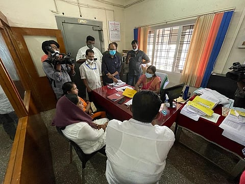 Ajesh's mother and children at the Muvattupuzha Urban Cooperative Bank on Friday, April 8, 2022.