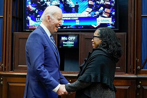President Joe Biden holds hands with Supreme Court nominee Judge Ketanji Brown Jackson as they watch the Senate vote on her confirmation from the Roosevelt Room of the White House. ( Photo | AP)