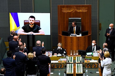 President Volodymyr Zelenskyy addresses the House of Representatives via a video link at Parliament House in Canberra. He appealed directly to Australian lawmakers for more help . ( Photo | AP)