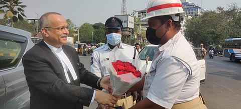 Telangana HC Chief Justice Satish Chandra Sharma fecilitates home guard Ashraf Ali. (Photo | Special Arrangement)