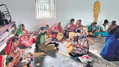 Craftpersons weaving golden grass products at Taranda village | Express