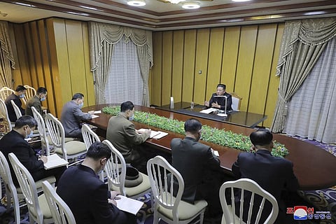 North Korean leader Kim Jong Un, top, visits state emergency epidemic prevention headquarters in North Korea. (Photo | AP)